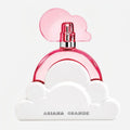 Perfume bottle with pink cap and cloud design on a white background