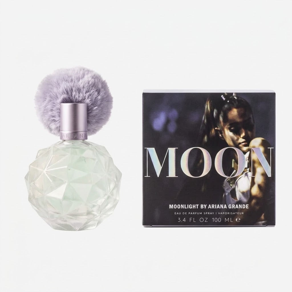 Perfume bottle with gray fuzzy cap and packaging featuring a person, on a white background