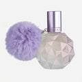 Perfume bottle with geometric design and purple pom-pom on a white background