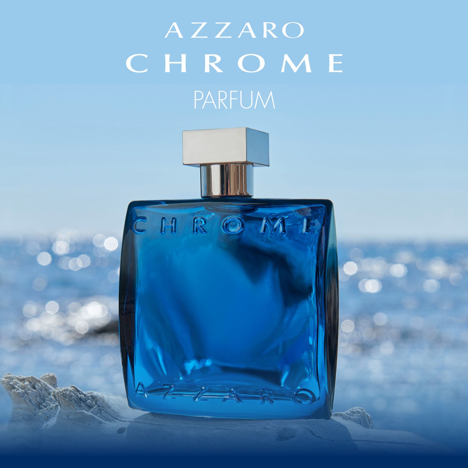 Blue Azzaro Chrome perfume bottle with ocean background