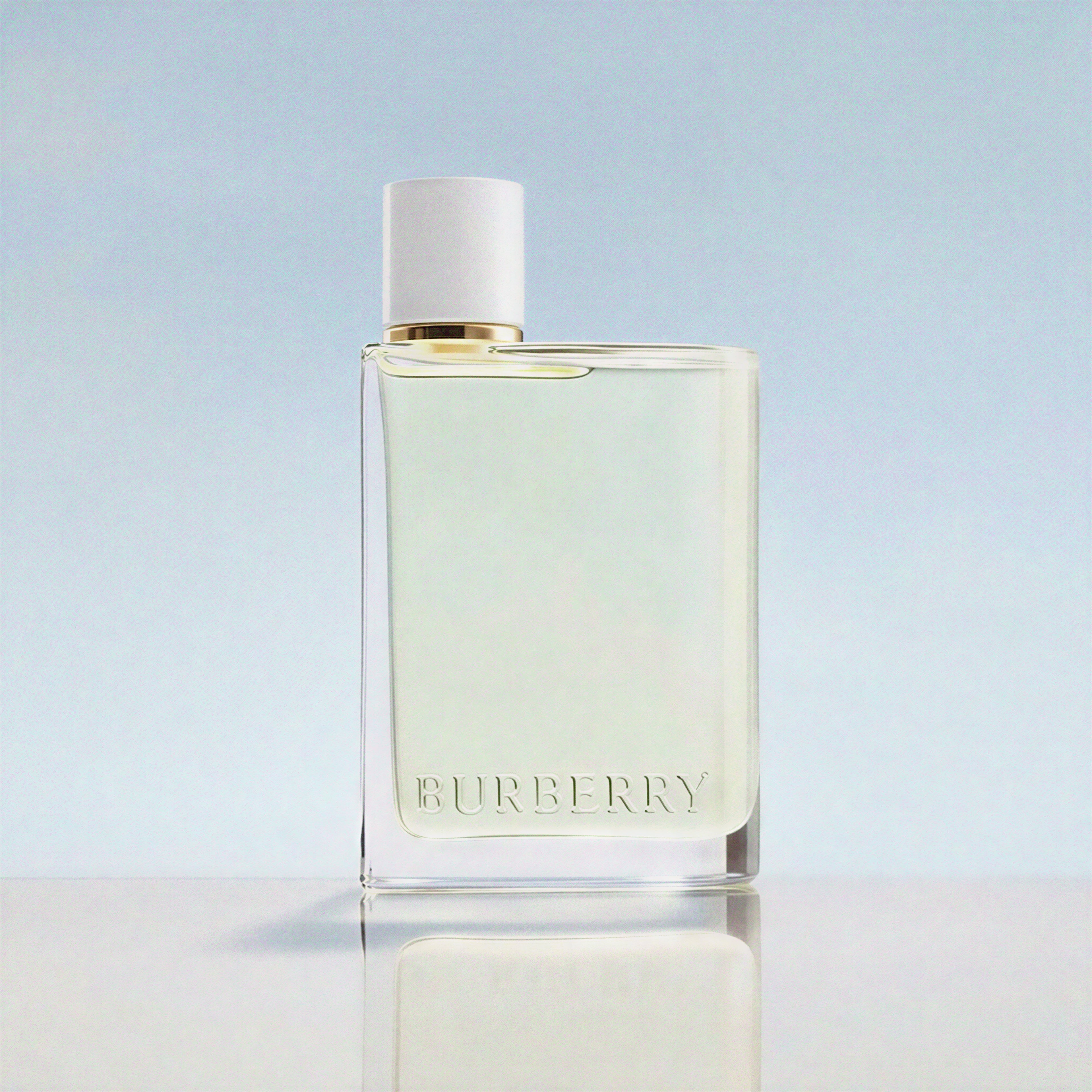 Burberry perfume bottle on a light blue background